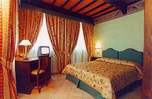 Imagen de la habitación del Villa Le Camelie Siena. Foto 12