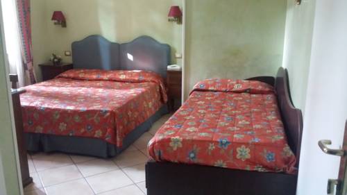 Imagen de la habitación del Villa Le Camelie Siena. Foto 16