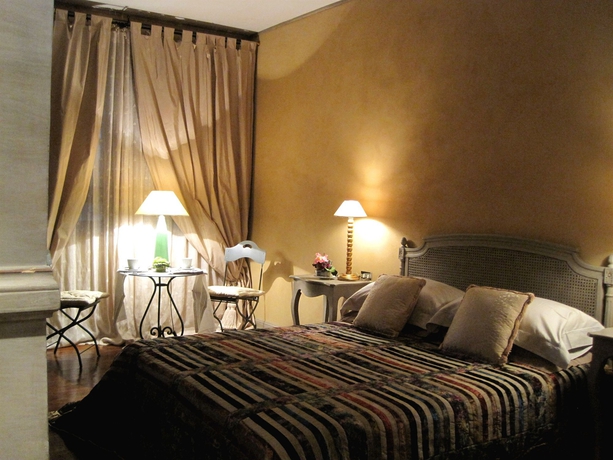 Imagen de la habitación del Villa Magnolia Relais. Foto 4