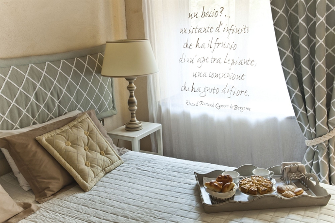 Imagen de la habitación del Villa Magnolia Relais. Foto 14