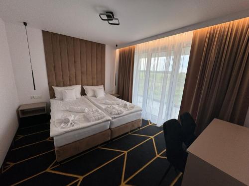 Imagen de la habitación del Villa Posh All Suites Hotel. Foto 19