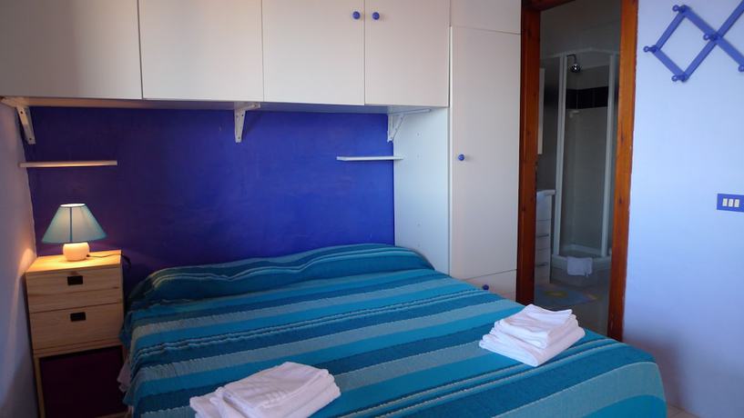 Imagen de la habitación del Villaggio Est. Foto 6
