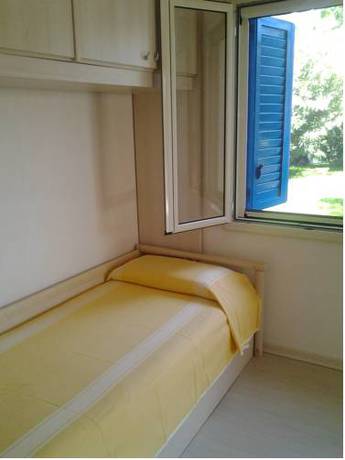 Imagen de la habitación del Villaggio Le Orchidee. Foto 4