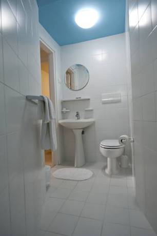 Imagen de la habitación del Villaggio Le Orchidee. Foto 6