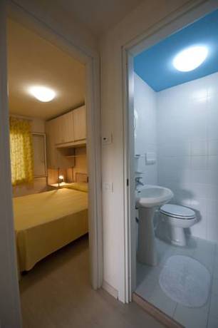 Imagen de la habitación del Villaggio Le Orchidee. Foto 7