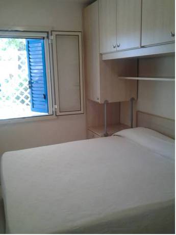 Imagen de la habitación del Villaggio Le Orchidee. Foto 16
