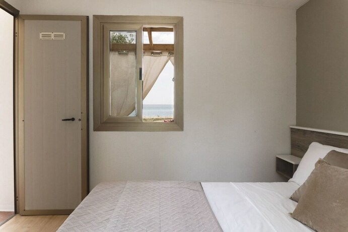 Imagen de la habitación del Villaggio Riva Del Sol. Foto 10