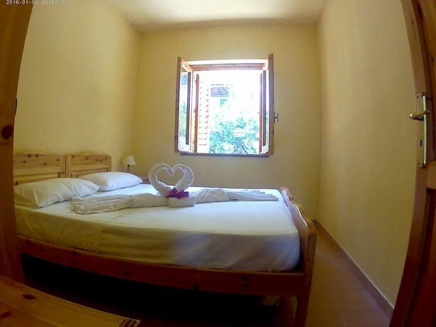 Imagen de la habitación del Villagio Camping La Scogliera. Foto 15