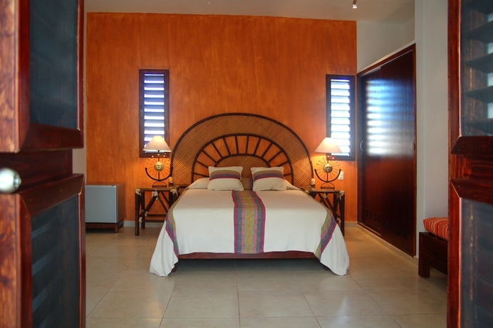 Imagen de la habitación del Villas El Encanto Cozumel. Foto 3