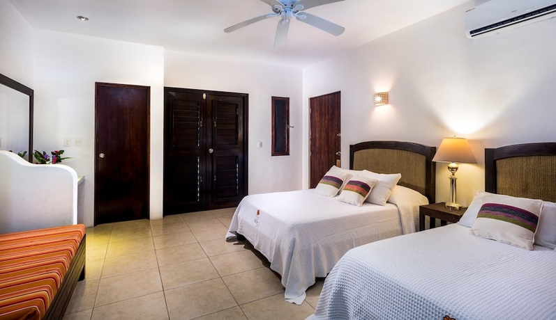 Imagen de la habitación del Villas El Encanto Cozumel. Foto 6