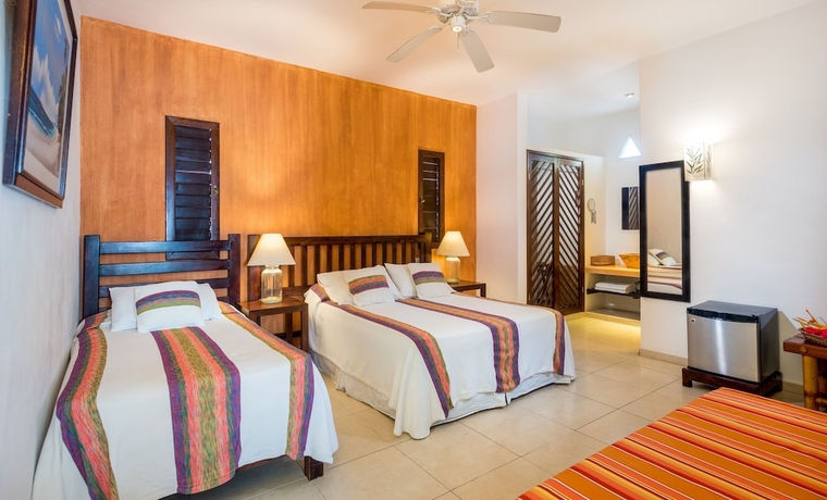 Imagen de la habitación del Villas El Encanto Cozumel. Foto 7