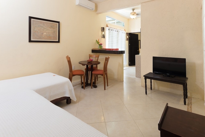 Imagen de la habitación del Villas El Encanto Cozumel. Foto 11