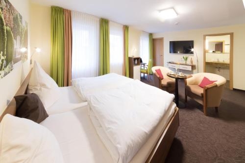 Imagen de la habitación del Vitalhotel Garni Vier Jahreszeiten. Foto 10