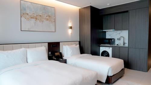 Imagen de la habitación del WAVEM HOTEL East. Foto 17