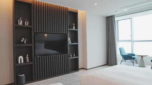 Imagen de la habitación del WAVEM HOTEL East. Foto 20