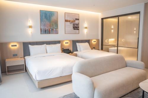 Imagen de la habitación del WAVEM HOTEL west. Foto 13