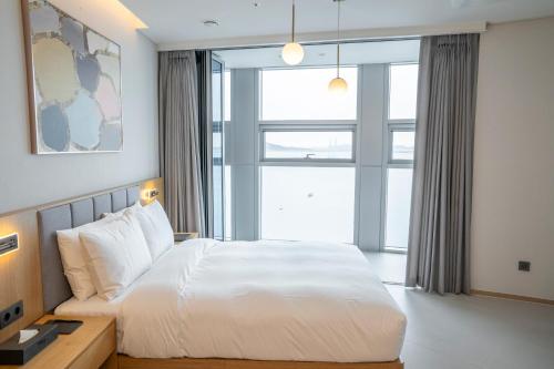 Imagen de la habitación del WAVEM HOTEL west. Foto 16