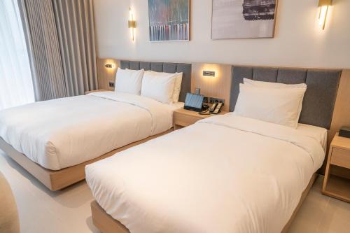 Imagen de la habitación del WAVEM HOTEL west. Foto 20