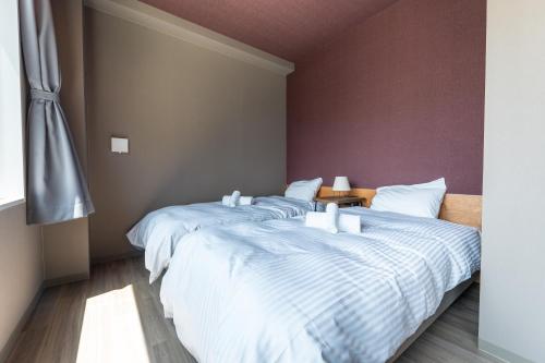 Imagen de la habitación del WISE OWL HOSTELS SAPPORO. Foto 12
