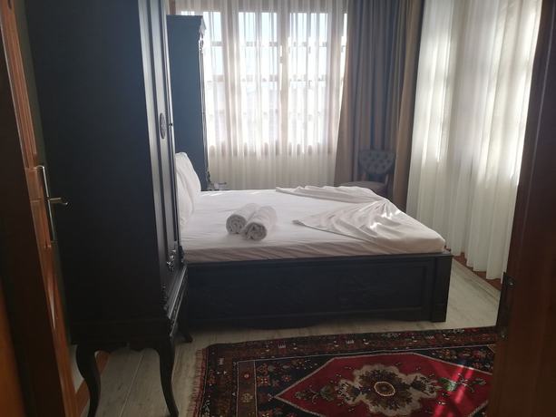 Imagen de la habitación del WOO Town Suites. Foto 4
