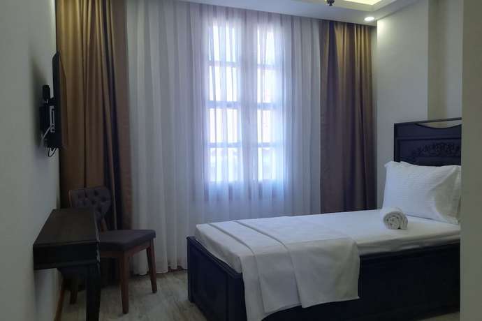 Imagen de la habitación del WOO Town Suites. Foto 5