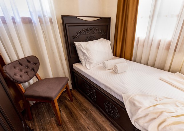 Imagen de la habitación del WOO Town Suites. Foto 6