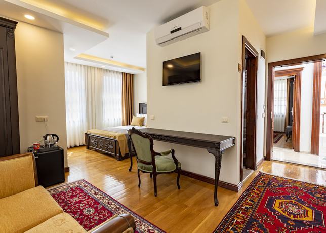 Imagen de la habitación del WOO Town Suites. Foto 15