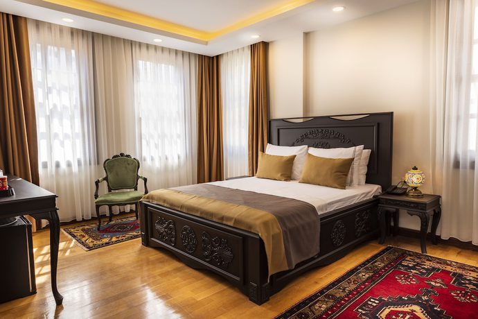 Imagen de la habitación del WOO Town Suites. Foto 16