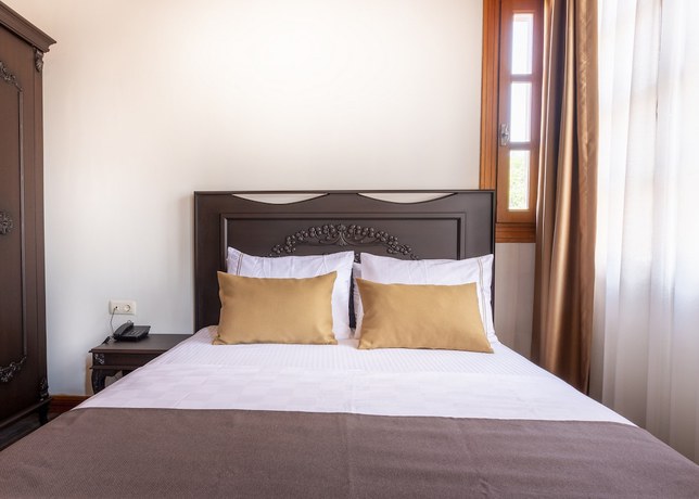 Imagen de la habitación del WOO Town Suites. Foto 19