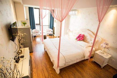 Imagen de la habitación del Wei Shi Dun Apartment. Foto 9