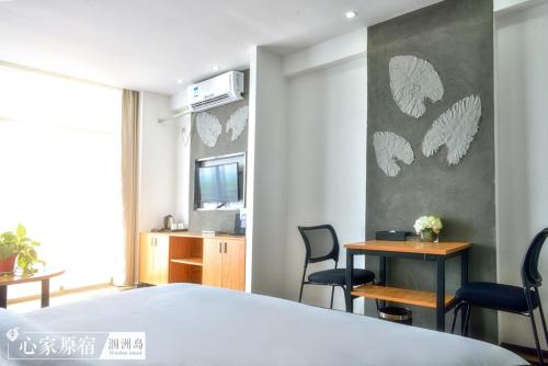 Imagen de la habitación del Weizhou Island Xinjia Yuansu Hotel. Foto 7