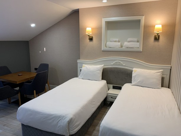 Imagen de la habitación del White Golden Suite Hotel. Foto 10