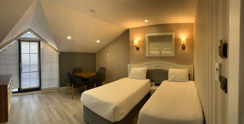 Imagen de la habitación del White Golden Suite Hotel. Foto 14