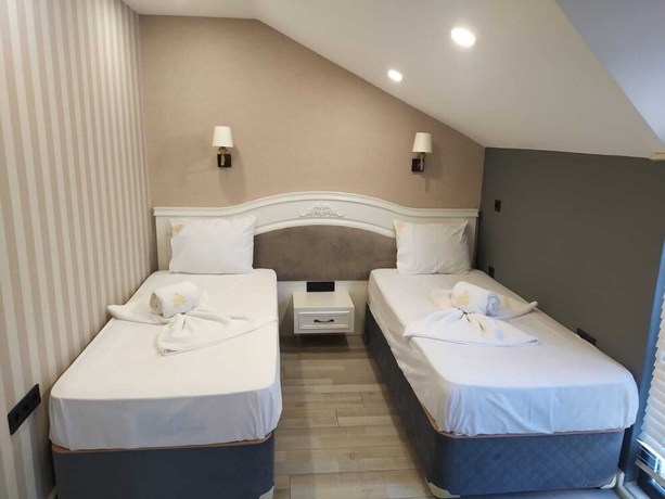 Imagen de la habitación del White Golden Suite Hotel. Foto 15