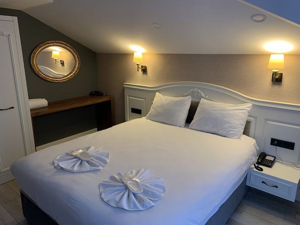 Imagen de la habitación del White Golden Suite Hotel. Foto 17