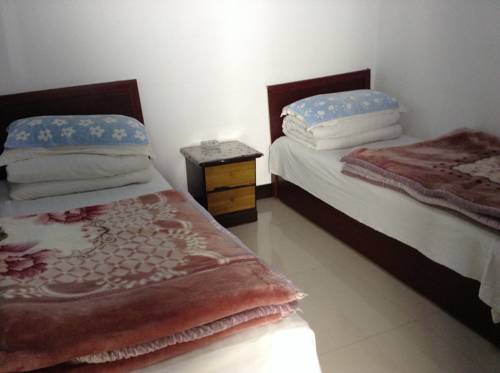 Imagen de la habitación del Wutaishan Xin Tai Inn. Foto 6