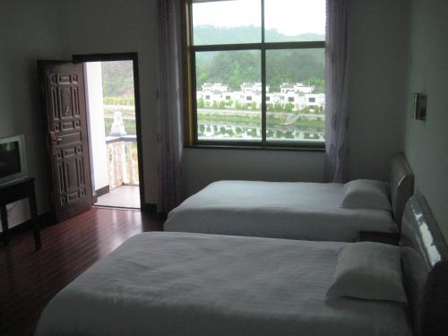 Imagen general del Wuyuan Lvxing Homestay. Foto 4
