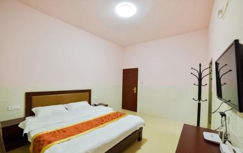 Imagen de la habitación del Xiamen Huizhongzhijia Inn. Foto 5