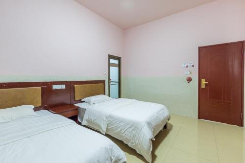 Imagen de la habitación del Xiamen Huizhongzhijia Inn. Foto 7