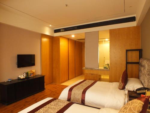 Imagen de la habitación del Xiangyang Huayi Hotel. Foto 7