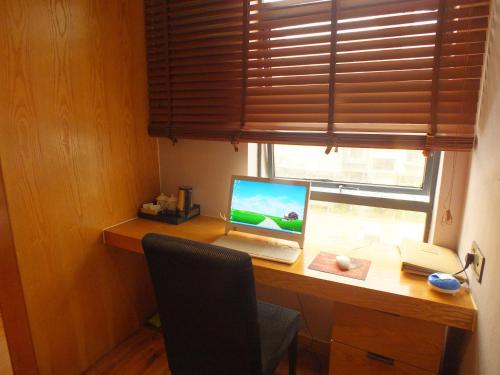 Imagen de la habitación del Xiangyang Huayi Hotel. Foto 8