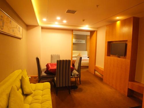 Imagen de la habitación del Xiangyang Huayi Hotel. Foto 9