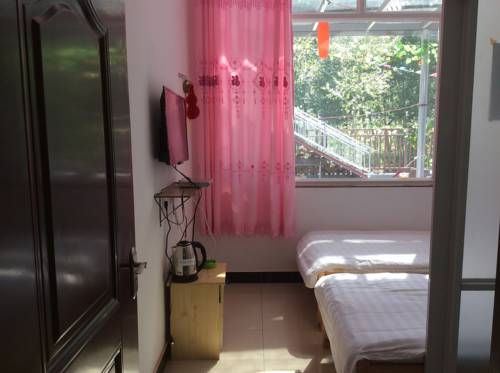 Imagen de la habitación del Xingfu Xiaoyuan Homestay. Foto 1