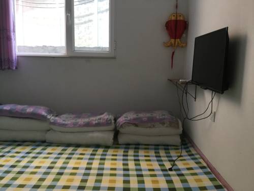 Imagen de la habitación del Xingfu Xiaoyuan Homestay. Foto 5