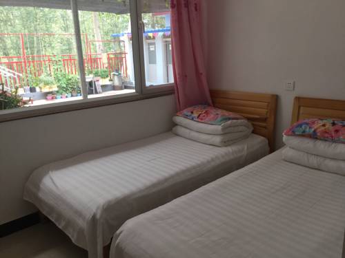 Imagen de la habitación del Xingfu Xiaoyuan Homestay. Foto 6
