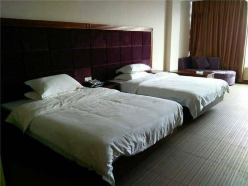 Imagen de la habitación del Xinglong Huangxin Business Inn. Foto 8