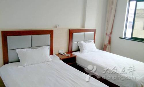 Imagen de la habitación del Xinlong Inn. Foto 5