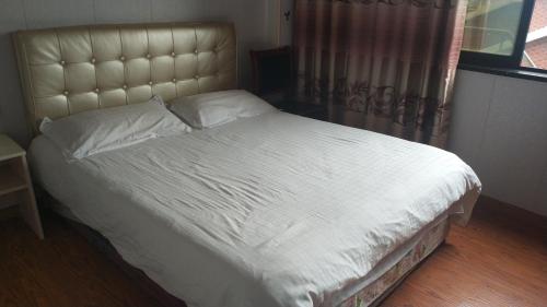 Imagen de la habitación del Xinlong Inn. Foto 6