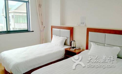 Imagen de la habitación del Xinlong Inn. Foto 7