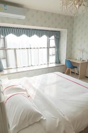 Imagen general del Xinyang City Celebrity Apartment. Foto 6